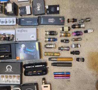 Box of vape mods and accessories